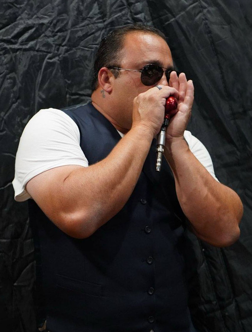 Stevie B playing the mouth organ